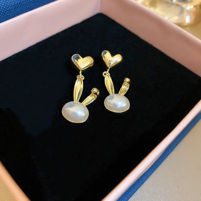 2022 Nueva tendencia Pendientes largos de perlas de simulación Pendientes colgantes de boda con diamantes de imitación y flores para mujer Pendientes de joyería coreana de moda