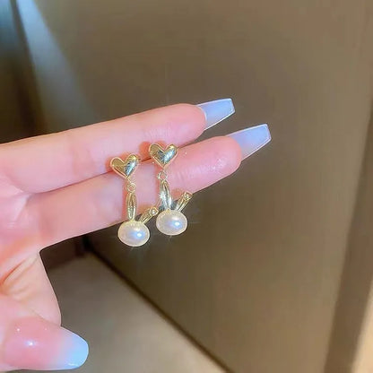 2022 Nueva tendencia Pendientes largos de perlas de simulación Pendientes colgantes de boda con diamantes de imitación y flores para mujer Pendientes de joyería coreana de moda