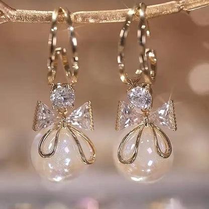 2022 Nueva tendencia Pendientes largos de perlas de simulación Pendientes colgantes de boda con diamantes de imitación y flores para mujer Pendientes de joyería coreana de moda