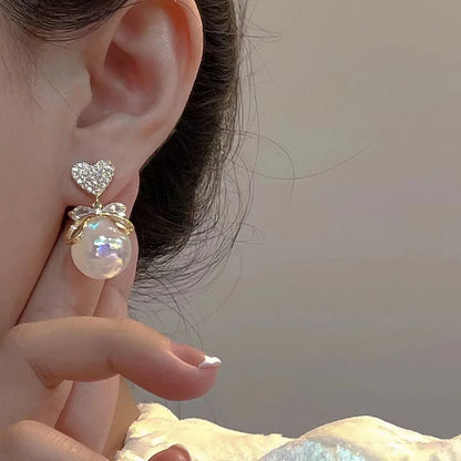 2022 Nueva tendencia Pendientes largos de perlas de simulación Pendientes colgantes de boda con diamantes de imitación y flores para mujer Pendientes de joyería coreana de moda